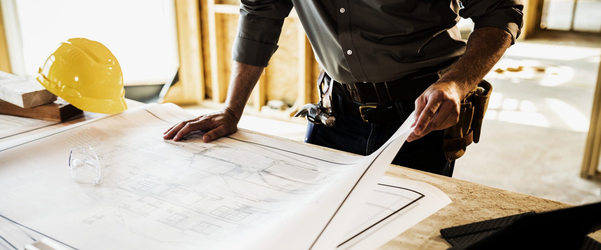 Home builder studying plans